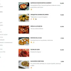 Menu z daniami: jajka z szynką (13,50€), krokiety (8,50€), uszy wieprzowe (9,00€), ziemniaki (6,75€), wołowina (13,75€), karczochy (3,75€). Sprawdź, ile kosztuje obiad w Hiszpanii.